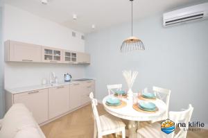 Kuchyň nebo kuchyňský kout v ubytování Apartament na klifie - Łukęcin