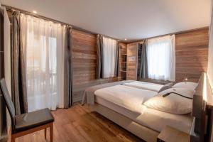 Postel nebo postele na pokoji v ubytování Alpine Lodge