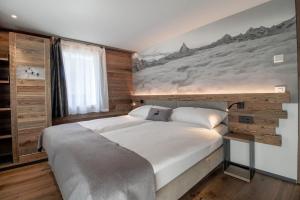 Postel nebo postele na pokoji v ubytování Alpine Lodge