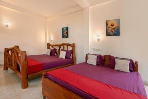 Postel nebo postele na pokoji v ubytování Ayurvedic Lanka Wellness Hotel