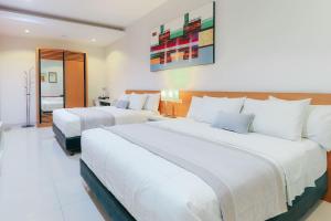 Postel nebo postele na pokoji v ubytování HOME Guesthouse