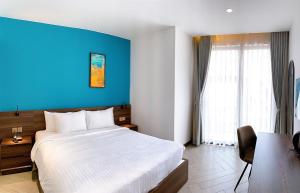 Postel nebo postele na pokoji v ubytování CHAU KHUONG HOTEL