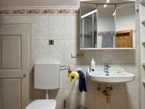 Ein Badezimmer in der Unterkunft Sunside Apartments Gästehaus