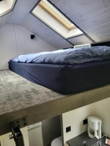 Postel nebo postele na pokoji v ubytování Bigge Elements Tinyhaus 4 "Magie"
