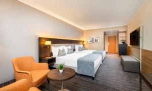 Posteľ alebo postele v izbe v ubytovaní Wyndham Grand Salzburg Conference Centre
