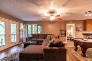 a living room with a couch and a table at Grand View in Seven Devils