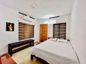 Mundro Garden Homestay客房内的一张或多张床位