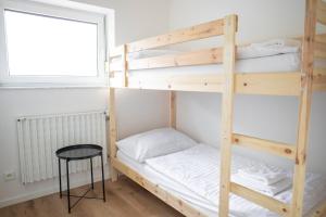 Posteľ alebo postele v izbe v ubytovaní Amenity Apartmány Perná