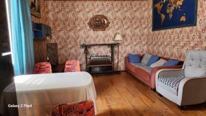 a living room with two couches and a fireplace at Pine house in Gürgan +35 photos