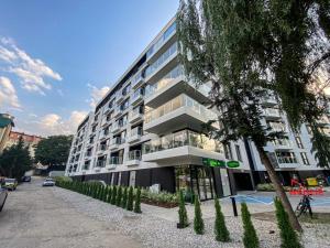 a large building with a street in front of it at apartament mono loft in Ełk