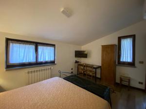 TV a/nebo společenská místnost v ubytování B&B Monteguzzo