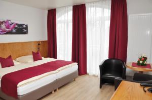 Postel nebo postele na pokoji v ubytování Garni Hotel Alber