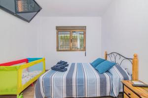 a bedroom with a bed and a window at Cortijo El Paraíso Granada in Atarfe +55 photos