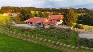 an aerial view of a house with a garden at Gronewald's Mountain View Holidays in Grünenbach