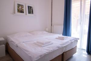 Posteľ alebo postele v izbe v ubytovaní Amenity Apartmány Perná