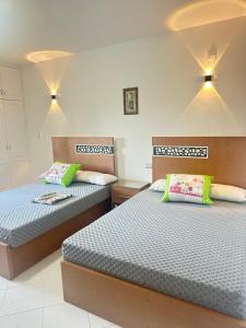 two beds in a room with two beds sidx sidx sidx at شاليه vip مارينا 5 الساحل الشمالي العلمين in El Alamein +35 photos