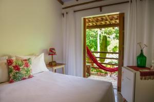 Cama ou camas em um quarto em Casa de Paixão Caraíva