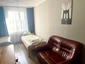 Postel nebo postele na pokoji v ubytování Riverside Motel Jelgava