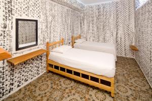 Ein Bett oder Betten in einem Zimmer der Unterkunft Adrasan Kayaköy Villaları