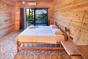 Ein Bett oder Betten in einem Zimmer der Unterkunft Adrasan Kayaköy Villaları