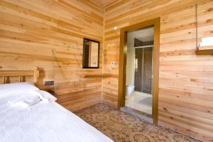 Ein Bett oder Betten in einem Zimmer der Unterkunft Adrasan Kayaköy Villaları