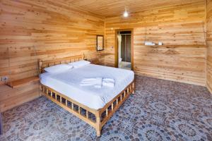 Ein Bett oder Betten in einem Zimmer der Unterkunft Adrasan Kayaköy Villaları