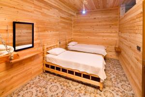 Ein Bett oder Betten in einem Zimmer der Unterkunft Adrasan Kayaköy Villaları
