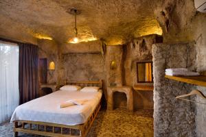 Ein Bett oder Betten in einem Zimmer der Unterkunft Adrasan Kayaköy Villaları