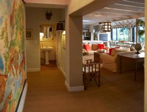 a living room with a couch and a table at Explorers Club in Franschhoek