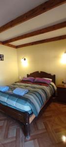 Hostal Km Zero El Huertillo客房内的一张或多张床位