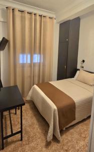 Postel nebo postele na pokoji v ubytování Hostal Prada