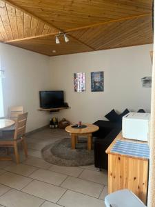 a living room with a couch and a table at Ferienwohnung Theisen in Bernkastel-Kues