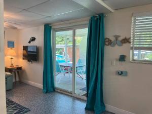 A television and/or entertainment centre at Pirate's Cove - Waterfront - Weeki Wachee River Access with Paddlecraft!!