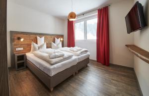 Łóżko lub łóżka w pokoju w obiekcie Appartements Liebe Heimat