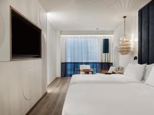 Ένα ή περισσότερα κρεβάτια σε δωμάτιο στο InterContinental Crete by IHG