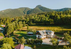an aerial view of a house with mountains in the background at Villa Seraf in Terchová