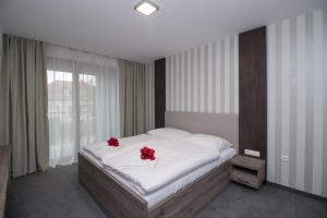 Postel nebo postele na pokoji v ubytování Guest House Frizzante