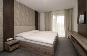 Postel nebo postele na pokoji v ubytování Guest House Frizzante