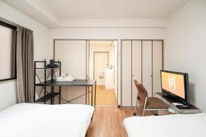 Letto o letti in una camera di 錦糸町