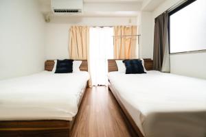 Letto o letti in una camera di 錦糸町