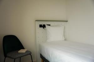 All Suites Appart Hôtel et Hôtel - Paris 13 - Porte d'Italie客房内的一张或多张床位