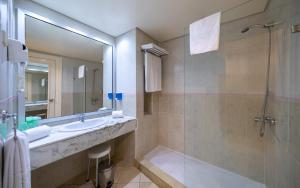 a bathroom with a sink and a shower at Marhaba Royal Salem - Family Only in Sousse