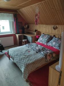 a bedroom with a large bed in a room at Apartmán Roztoky u Křivoklátu in Roztoky