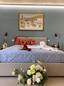 Postel nebo postele na pokoji v ubytování Suite San Giorgio B&B + 6 fotografií