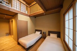 Kama o mga kama sa kuwarto sa 京都松澗Matsutani