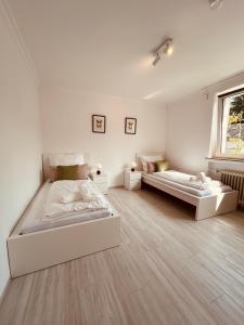 Katil atau katil-katil dalam bilik di H6 XL I EG I Balkon I Küche I Wasch I 6P I Smart