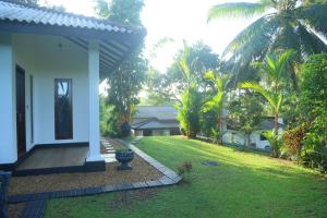 Κήπος έξω από το Villa Green Paradise