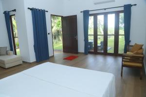 Ένα ή περισσότερα κρεβάτια σε δωμάτιο στο Villa Green Paradise