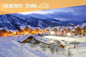 a resort in the mountains with snow on the ground at Le Budapest in Saint-Michel-de-Maurienne