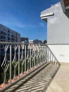 a fence on a balcony of a building at Casa Augusta 6 in Braga +17 photos